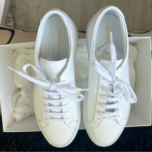 woman by common projects sneakers